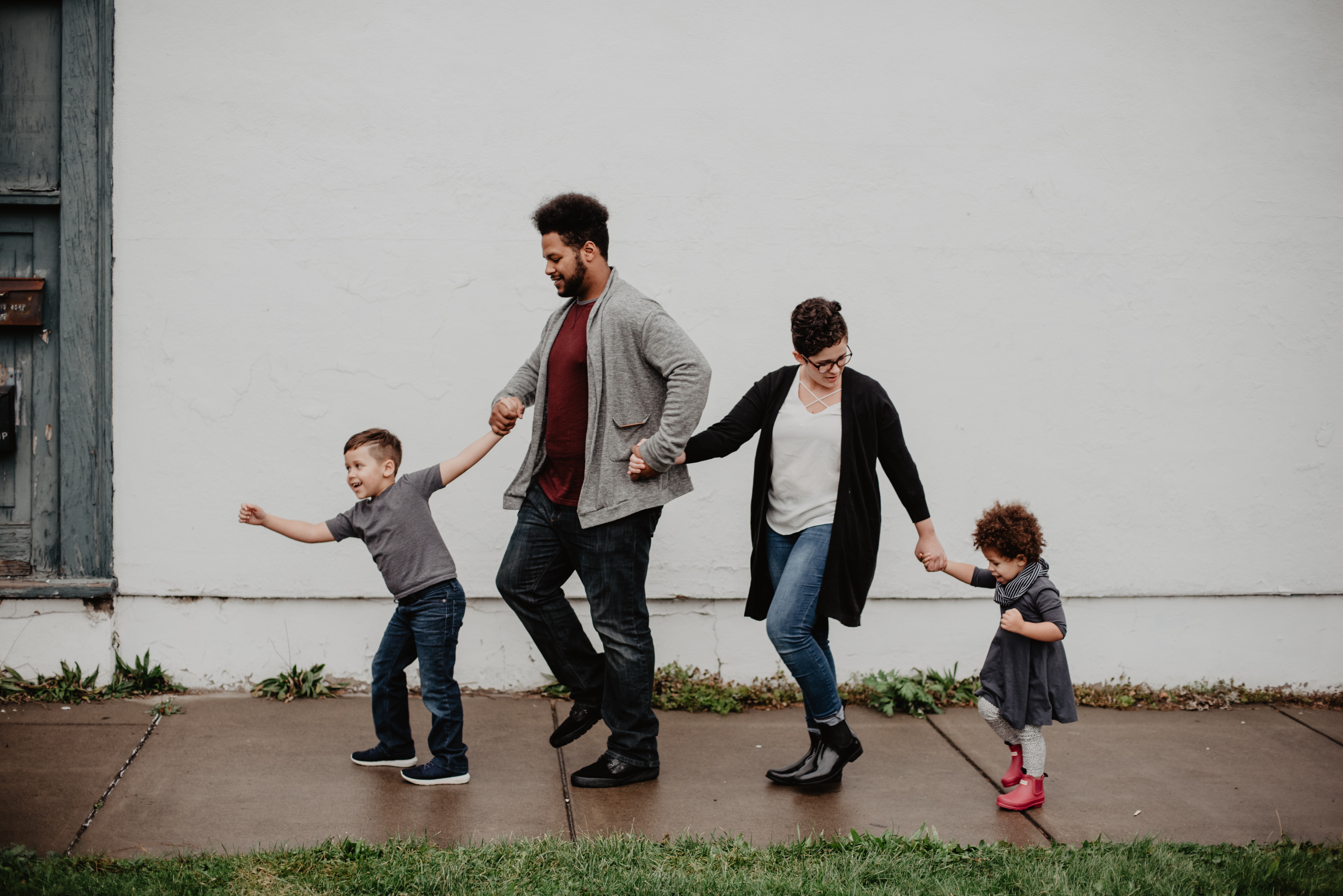 family-of-four-walking-at-the-street-2253879.jpg