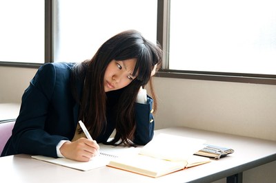 japanese-high-school-student-writing-in-her-notebook.jpg